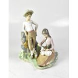 LLADRÓ; a figure group of boy and girl feeding a lamb, height 29cm.