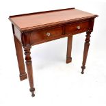 A Victorian mahogany two-drawer side table, raised on hexagonal tapering legs to peg feet,