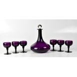 A purple glass mallet-shaped decanter with silver plated stopper, height 25cm,