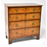 A 19th century walnut chest of four long graduated drawers, raised on bracket feet,