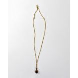 An 18ct gold necklace with claw set garnet in a gold pendant mount, length of chain approx 38cm,