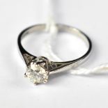 An 18ct white gold solitaire ring, the claw set brilliant cut diamond approx 0.