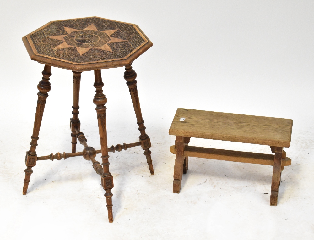 A c1900 Continental carved walnut octagonal occasional table raised on four turned and block