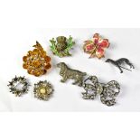A quantity of vintage costume brooches to include animal themed examples (8).