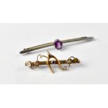 Two bar brooches comprising a white metal example with central oval amethyst stone, length 6cm,