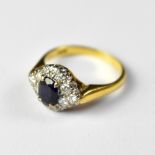 An 18ct gold sapphire and diamond ring,