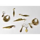 Five pairs of 9ct gold earrings to include shell-style hoops, leaf drops, etc,