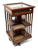 An Edwardian mahogany revolving bookcase with hinged bijouterie top, height 92cm.