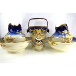A late 19th/early 20th century six-piece bedroom toiletry set comprising two large wash bowls and