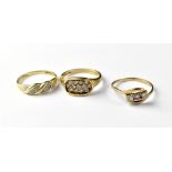 Three 9ct gold rings comprising one with an oval containing three lines of small white chips,