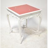 A white painted square occasional table with inset bevelled peach glass to the top,