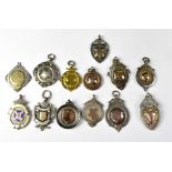 Thirteen early 20th century hallmarked silver prize fobs,