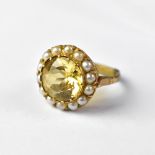 A 9ct gold dress ring with cut claw set central citrine,