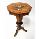 A Victorian walnut octagonal top sewing table with fitted interior and tapering trumpet-form column,