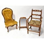 A Victorian walnut button back nursing chair with carved floral surmount,