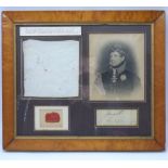 A framed montage of George IV related items to include a muslin handkerchief stamped with the small