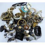 A large quantity of vintage and modern costume jewellery to include bracelets, cufflinks, earrings,