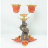 HEREND; a porcelain two-branch candelabrum in the form of a dolphin, factory stamp to base,