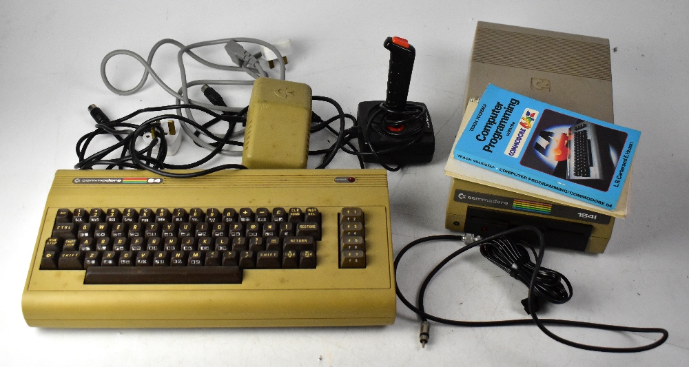 A Commodore 64 personal computer with powerbank, 154I disc reader, Pointmaster joystick,