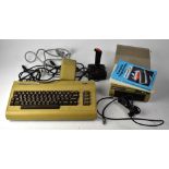 A Commodore 64 personal computer with powerbank, 154I disc reader, Pointmaster joystick,