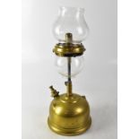 An unusual vintage brass paraffin lamp with two globular shades, height 43cm.