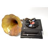 An Edwardian black lacquered wind-up gramophone.