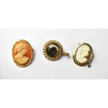 A yellow metal mourning brooch/pendant, set with graduated seed pearls to the borders and loop,