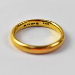 A 22ct gold wedding band, size R, approx 6.3g.