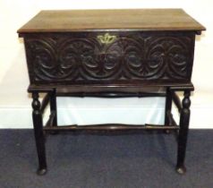 A 17th century oak chest with lift-up li