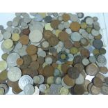 A quantity of mostly British coinage including pre-decimal examples and some world coins.