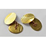 A pair of gentlemen's 9ct gold oval cufflinks, the front with Art Deco line design,