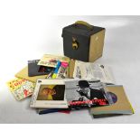 A record case containing a quantity of 45rpm singles and EPs to include Classical, Easy Listening,
