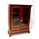 A reproduction Georgian-style mahogany floor standing display cabinet with Corinthian column detail
