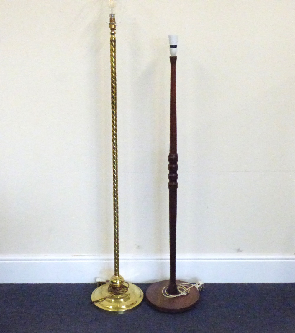 Two standard lamps, one brass with twist column and conical base,