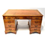 A Georgian-style mahogany desk with tool