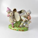 A 19th century Austrian porcelain figure group modelled as a couple of clowns,