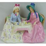 ROYAL DOULTON; a porcelain figure group of two ladies having tea HN1747 'Afternoon Tea'.