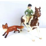 BESWICK; two figures, girl on pony, skewbald, gloss, 1499, and a fox (2).