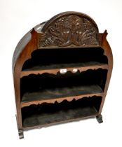 A 19th century set of shelves with carved floral surmount, on outswept feet, 60 x 64 x 19cm.