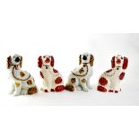Two pairs of Staffordshire seated spaniels (4).