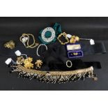 Various items of costume jewellery to include a gold thistle and amethyst-coloured stone bar brooch,