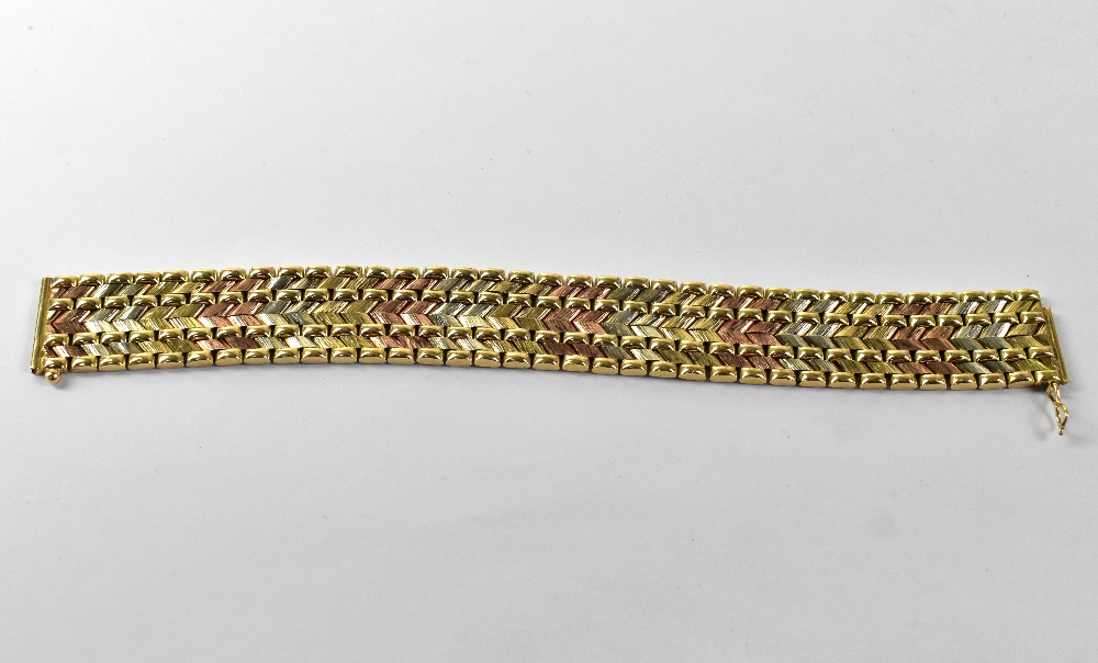 A 9ct three-colour gold woven bracelet with safety clasp, 2 x 19cm, approx 42.1g.