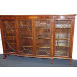 An Edwardian-style mahogany breakfront bookcase,