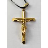 A 9ct gold crucifix on a black ribbon necklace, length of crucifix 5cm, approx 5g.
