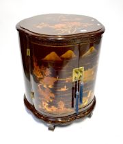 A Chinese lacquered drinks cabinet of shaped circular form,