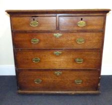 A late 18th early 19th century oak chest of two short over three graduated drawers,