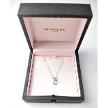 BOODLES; an 18ct white gold diamond set pendant in the form of the letter 'B',