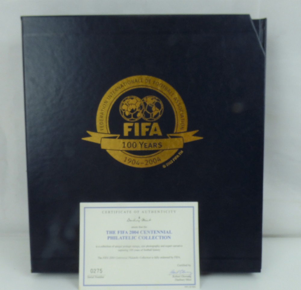DANBURY MINT; a boxed presentation album for the FIFA 2004 Centennial Philatelic Collection,