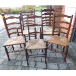 A harlequin set of five 20th century ladder back rush seated chairs comprising a pair of six rung