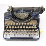 THE UNDERWOOD; a vintage black portable typewriter.